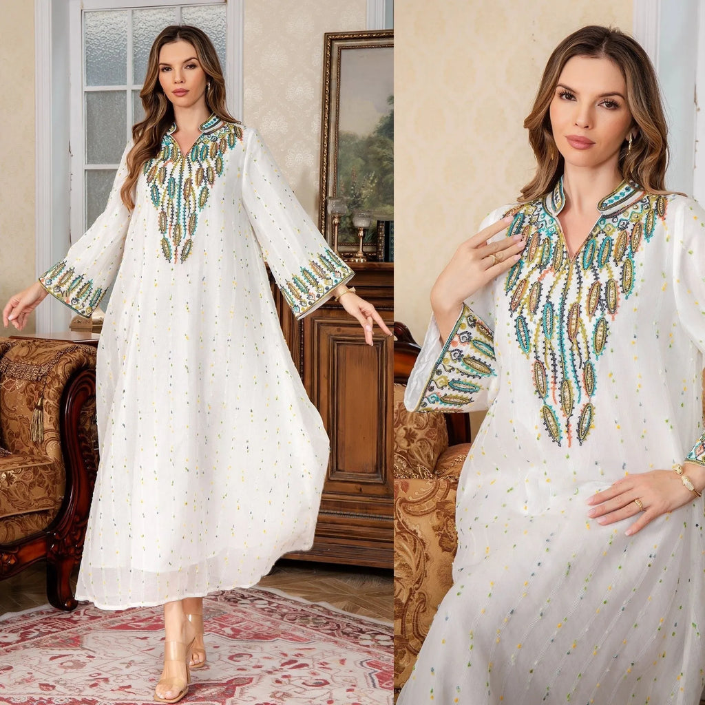 White long sleeve Arabic robe for women made from polyester, shown in a long skirt style.
