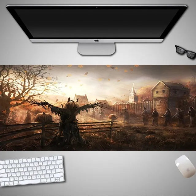 Oversized Halloween-themed computer mouse pad with non-slip rubber cloth base on a desk