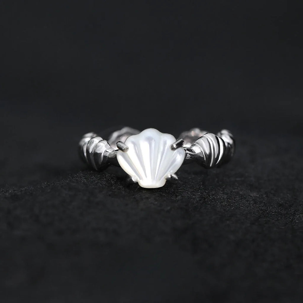 Women's adjustable sterling silver ring with shell decoration and tiger eye stone in original cold-style design
