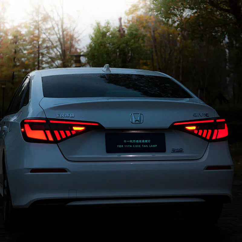 11th Generation Honda Civic black and red LED tail light assembly with sequential turn signal streamer.