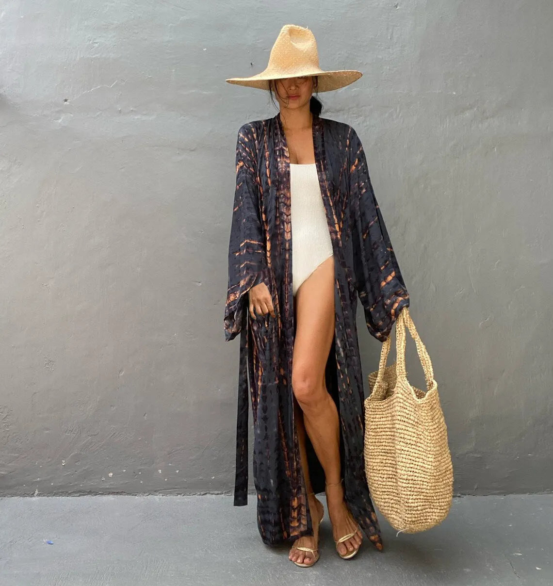 Loose-fitting cotton beach cover-up blouse in a printed pattern, shown in a rust red colour.