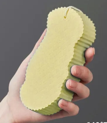 3D fish scale pattern bath sponge in light blue colour showing textured exfoliating surface