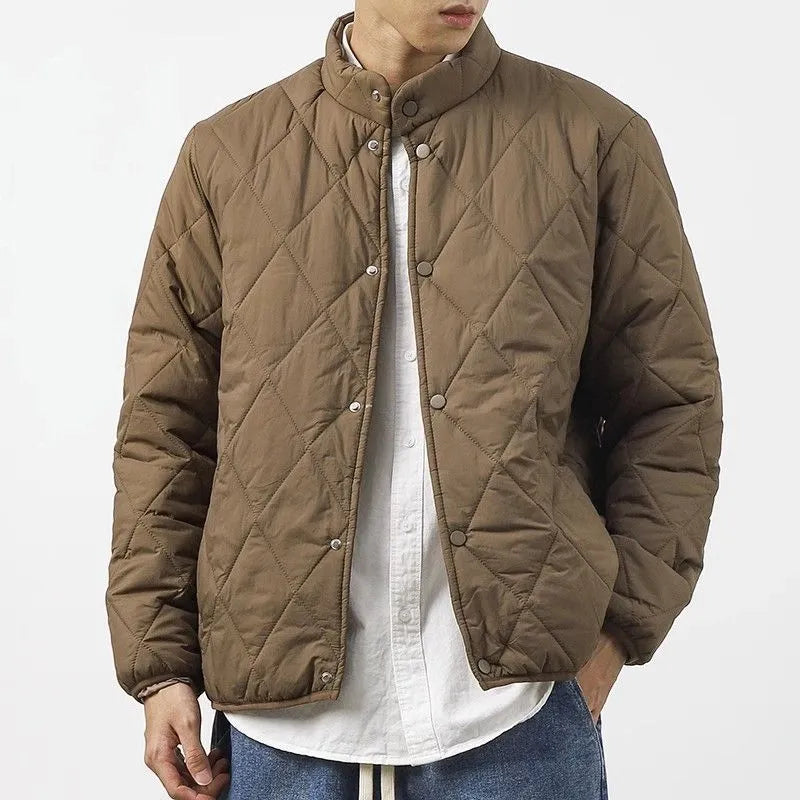 Men's black extended length winter jacket showing loose fit and urban style design