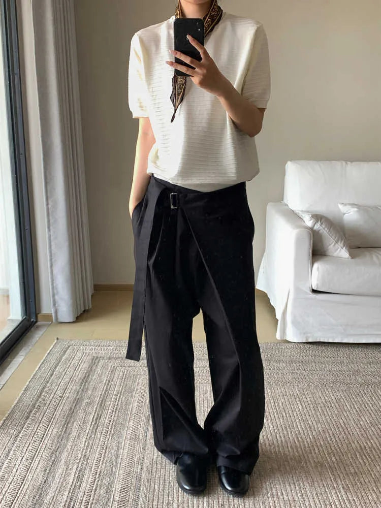Black loose fit straight-leg trousers with adjustable waistband and single pleat detail