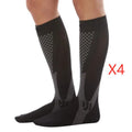 Black graduated compression socks with athletic fit for men and women, shown laid flat.