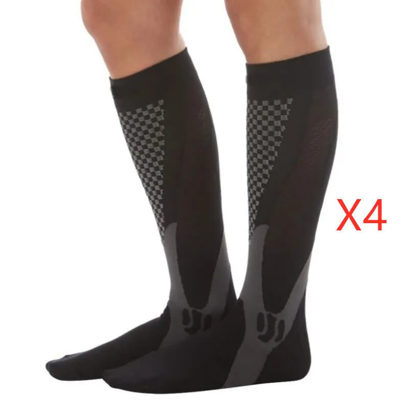 Black graduated compression socks with athletic fit for men and women, shown laid flat.