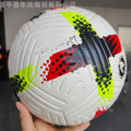 Fluorescent green size 5 PU football on a sports field