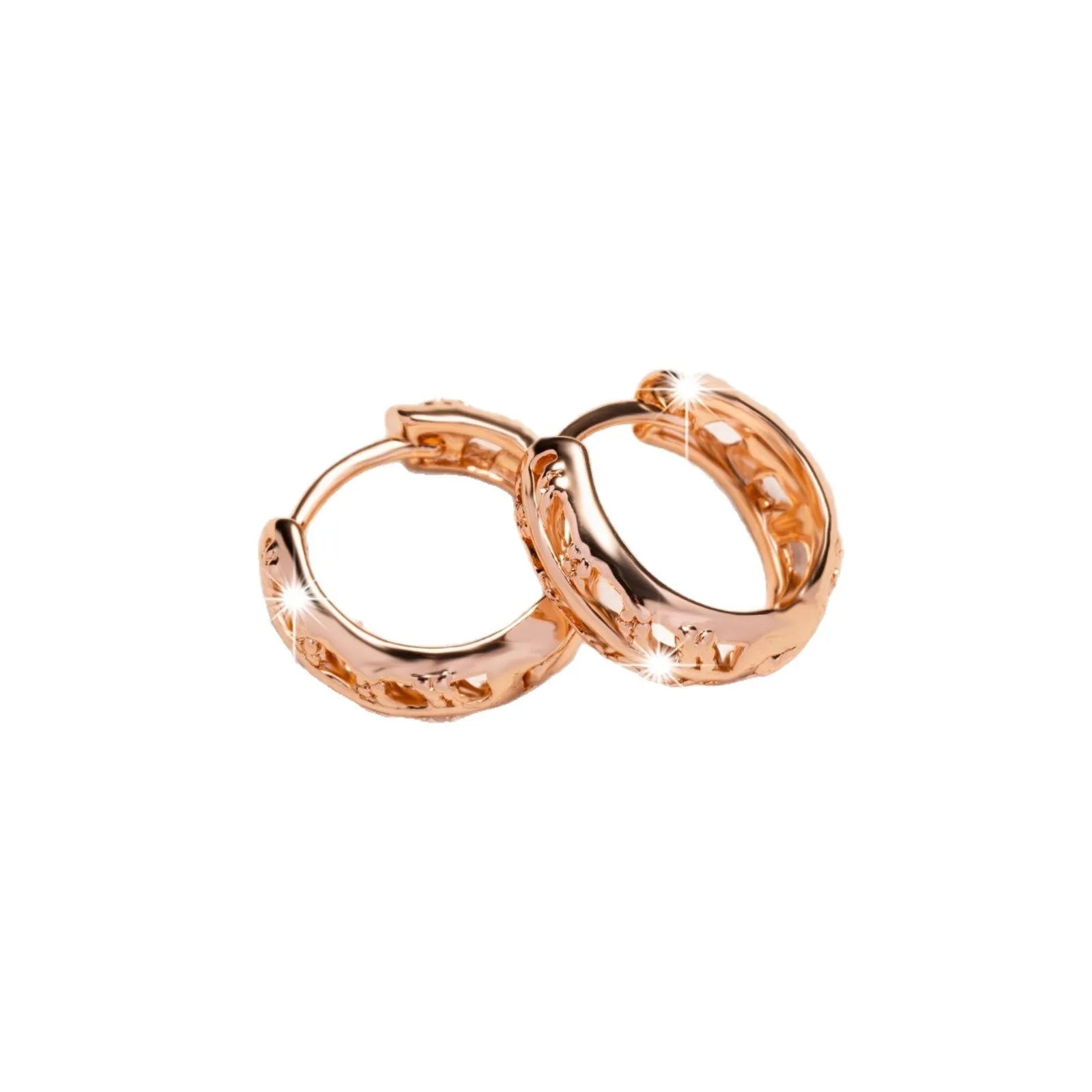 Rose gold hollow leaf earrings with a heart detail, made from copper.