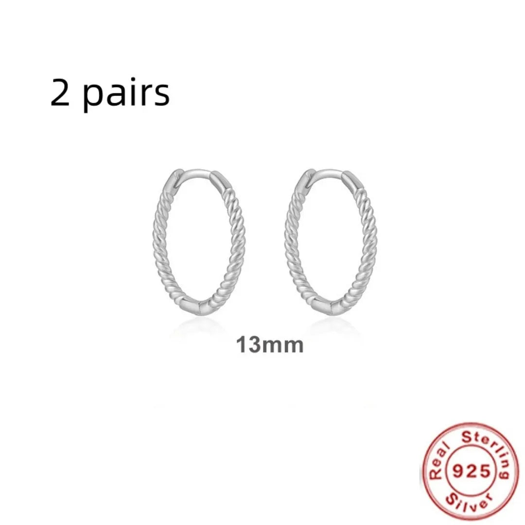 Sterling silver twisted hoop earrings with geometric round shape in gold electroplated finish