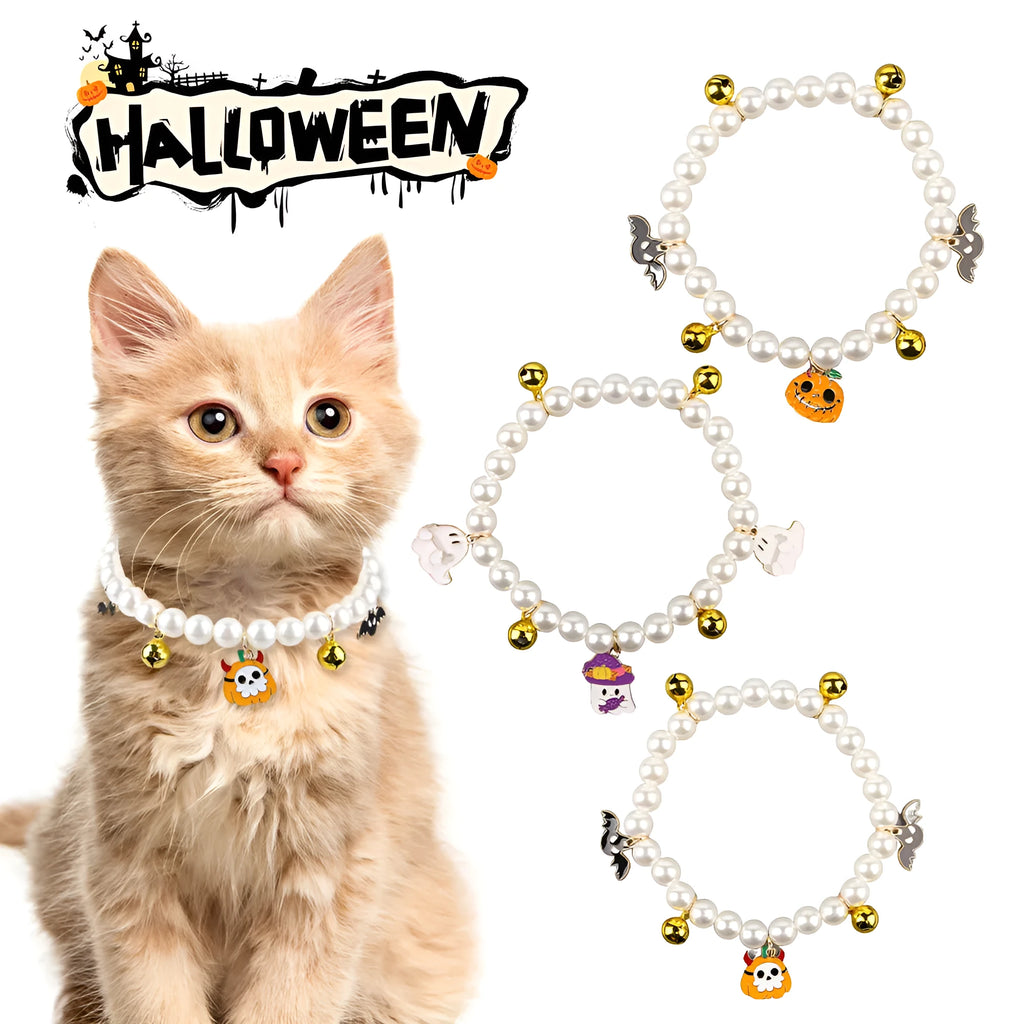 Close-up of a simulated pearl cat collar with a detailed Halloween pumpkin charm, showing the purple ghost design variant.
