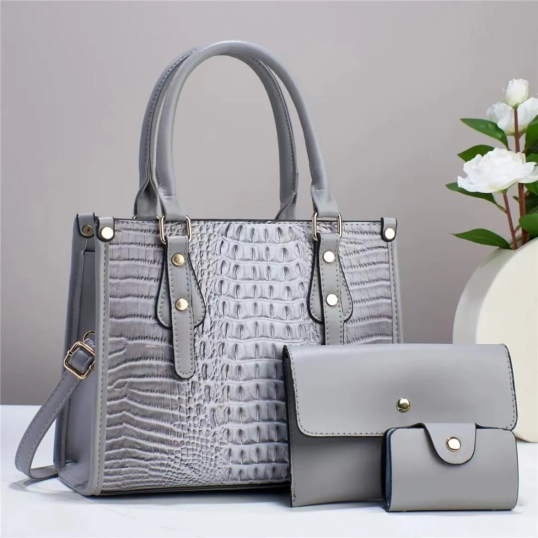 Three-piece PU bag set in chosen colour showing bucket crossbody bag, matching wallet, and card holder.
