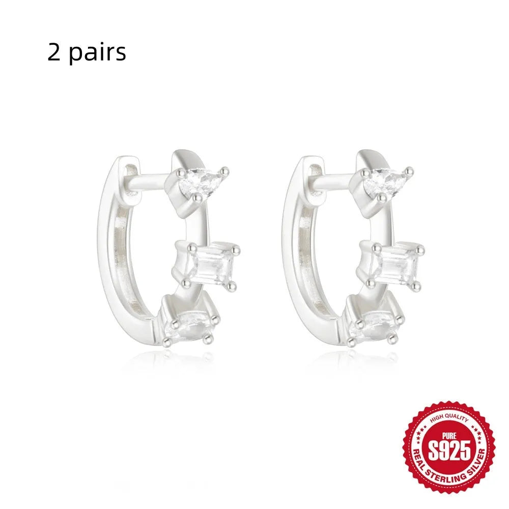 Sterling silver geometric stud earrings with small round designs in gold or silver electroplated finishes