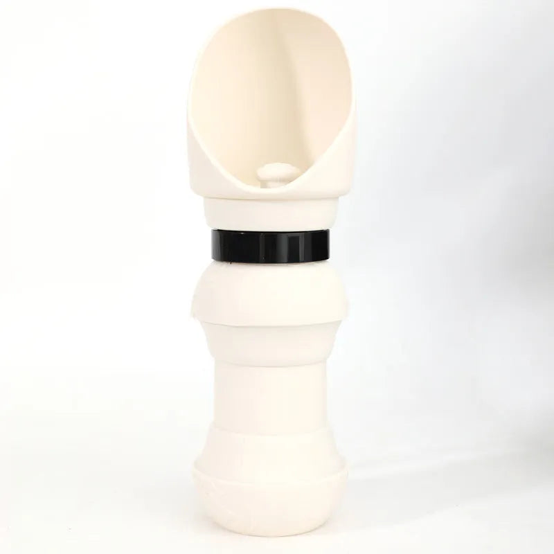 A folded and unfolded silicone water cup for pets, shown in green pineapple colour.
