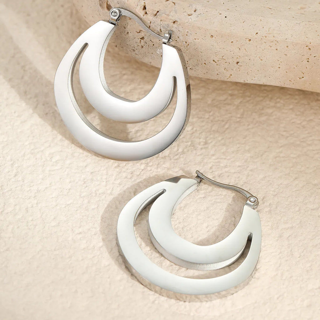 Geometric circular French earrings with gold plating on stainless steel, minimalist design