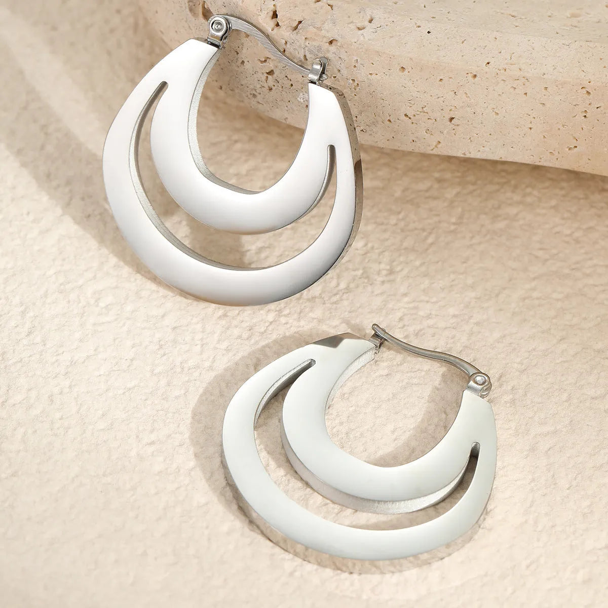 Geometric circular French earrings with gold plating on stainless steel, minimalist design
