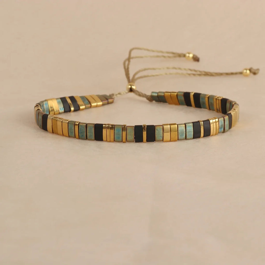 Geometric glass pull bead bracelet in five colour options on wrist