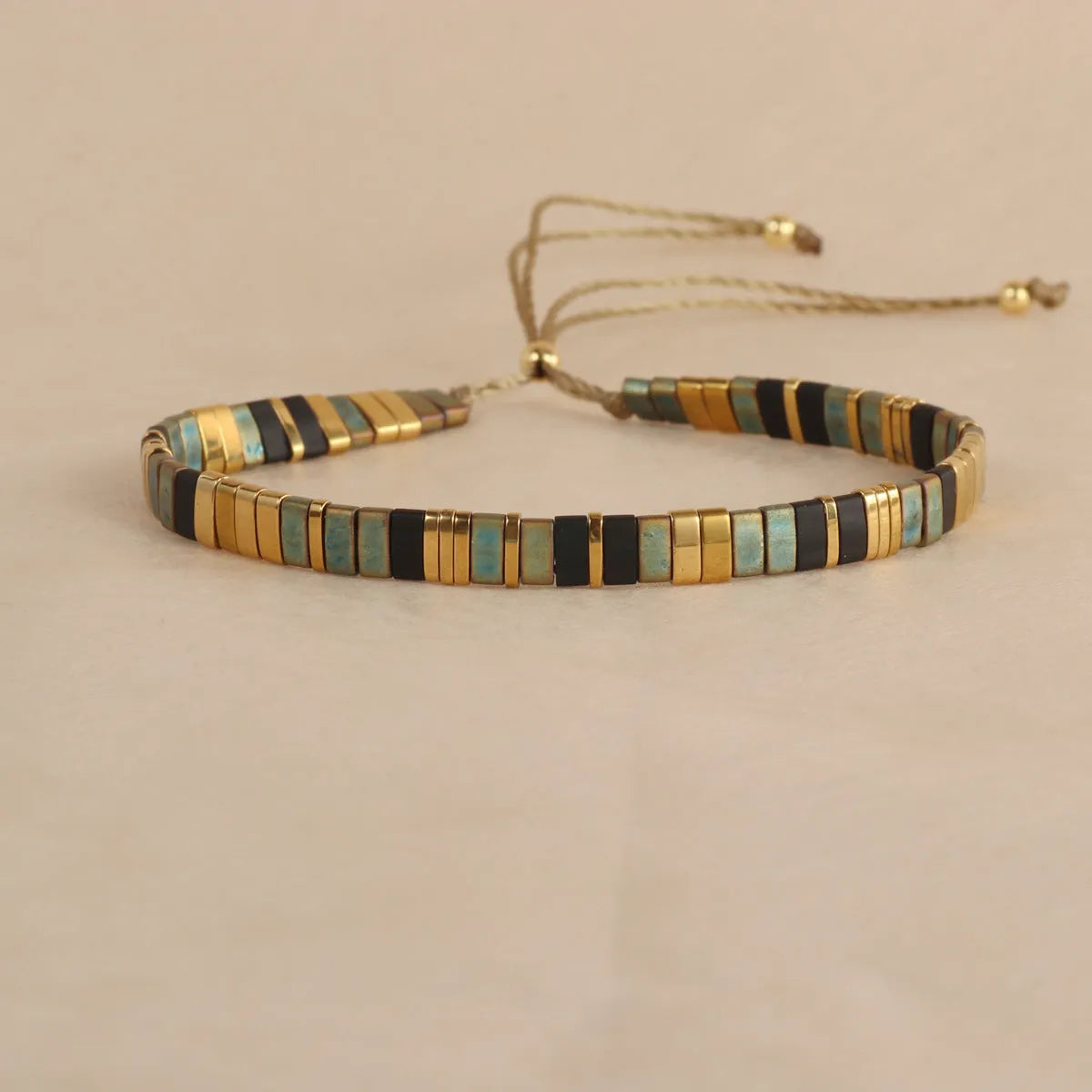 Geometric glass pull bead bracelet in five colour options on wrist