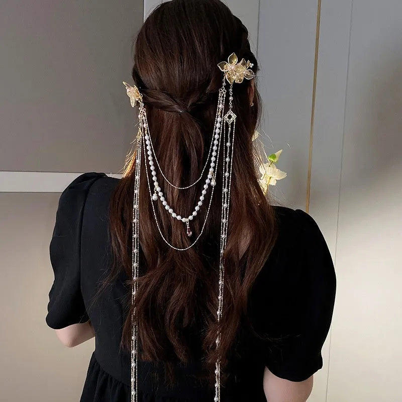 Gold women's hairpin with a pearl diamond flower and a long tassel.