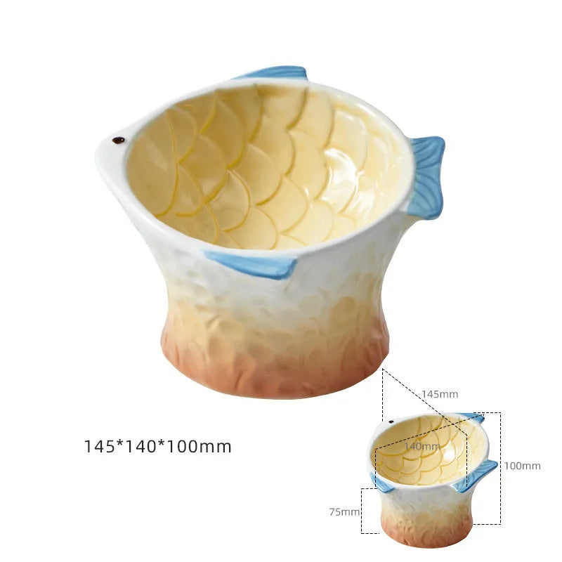 Set of four blue fish-shaped ceramic cat bowls with tilted design and elevated base