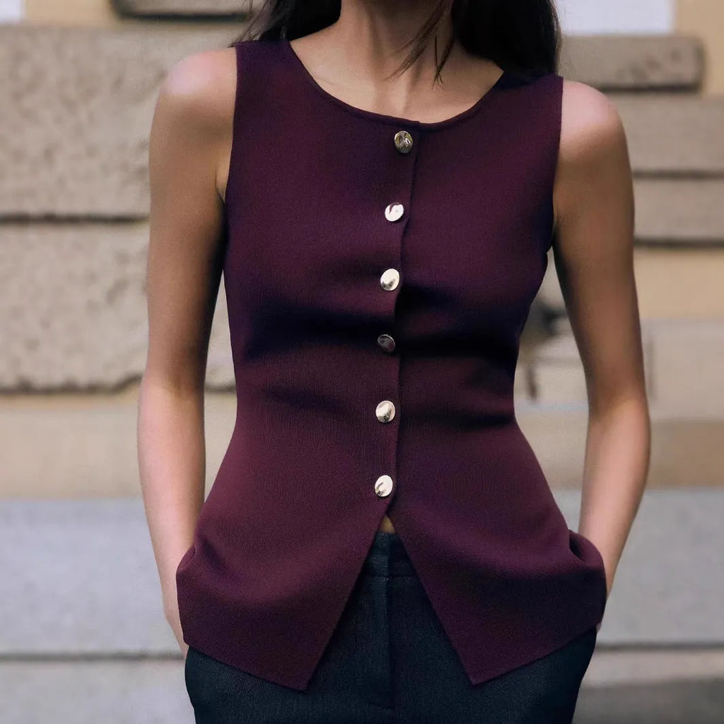Women's dark red slim fit viscose vest with gold buttons and a textured 3D pattern, shown on a hanger.