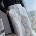 Men's solid colour straight-leg casual trousers in polyester fabric on a hanger.
