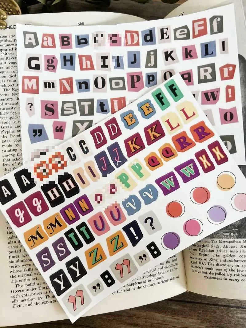 Set of printed English letter, number, and weekly word decoration stickers in assorted colours, laid out flat.