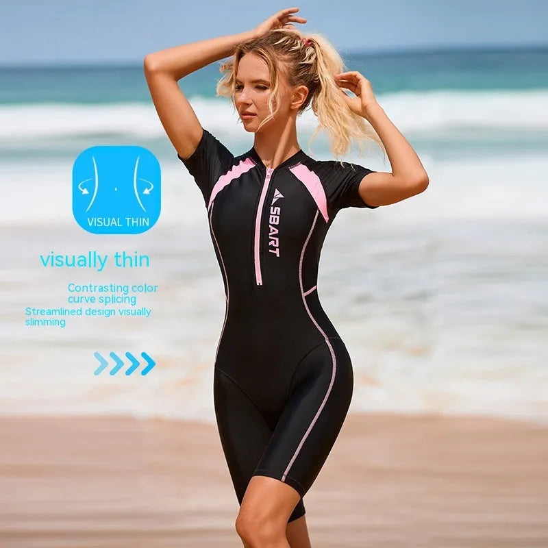 Women's solid colour one-piece swimsuit with short sleeves and chest pad in black pink or green blue.