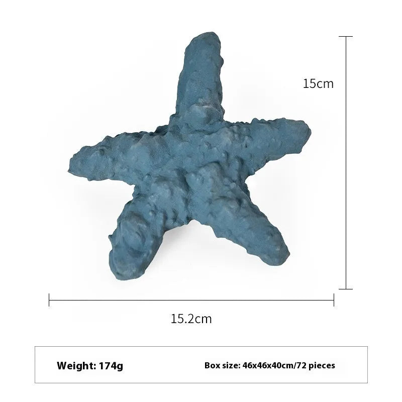 Blue rubber dog toy shaped like a shark conch for food dispensing and chewing.