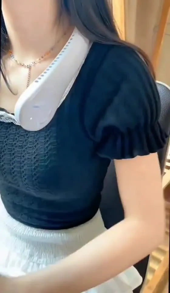 Blue bladeless neck fan with USB charging cable, worn around neck.