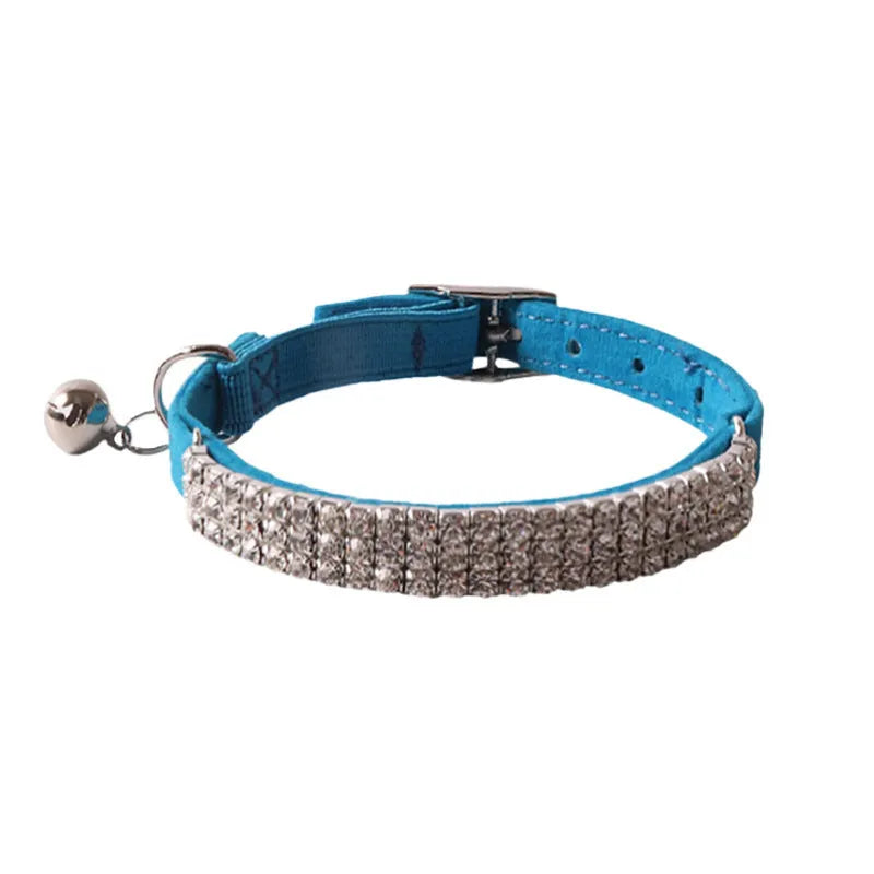 Soft pink flocking cat collar with silver elastic buckle, shown adjusted to fit.