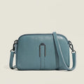 Women's genuine leather square shoulder bag in dark khaki colour, showing its structured shape and shoulder strap.