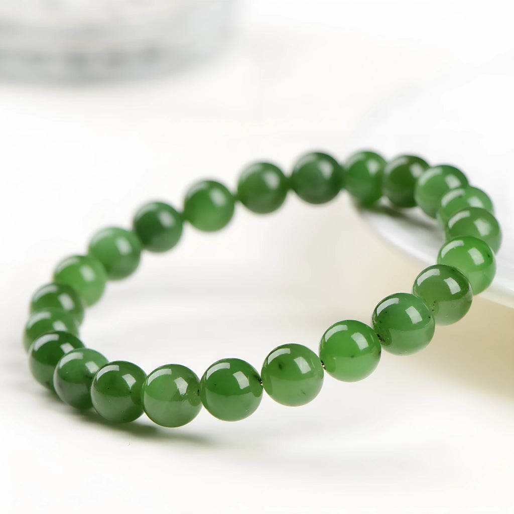 Natural jasper bead bracelet with polished spherical beads on a string, available in multiple sizes.