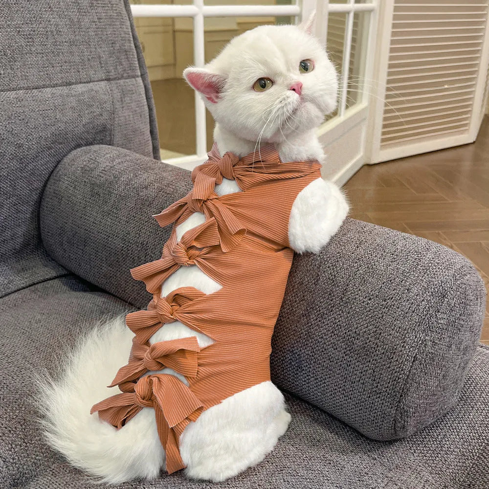 Lace-up polyester cat sterilisation recovery garment shown in blue, brown, green pineapple, pink, or purple