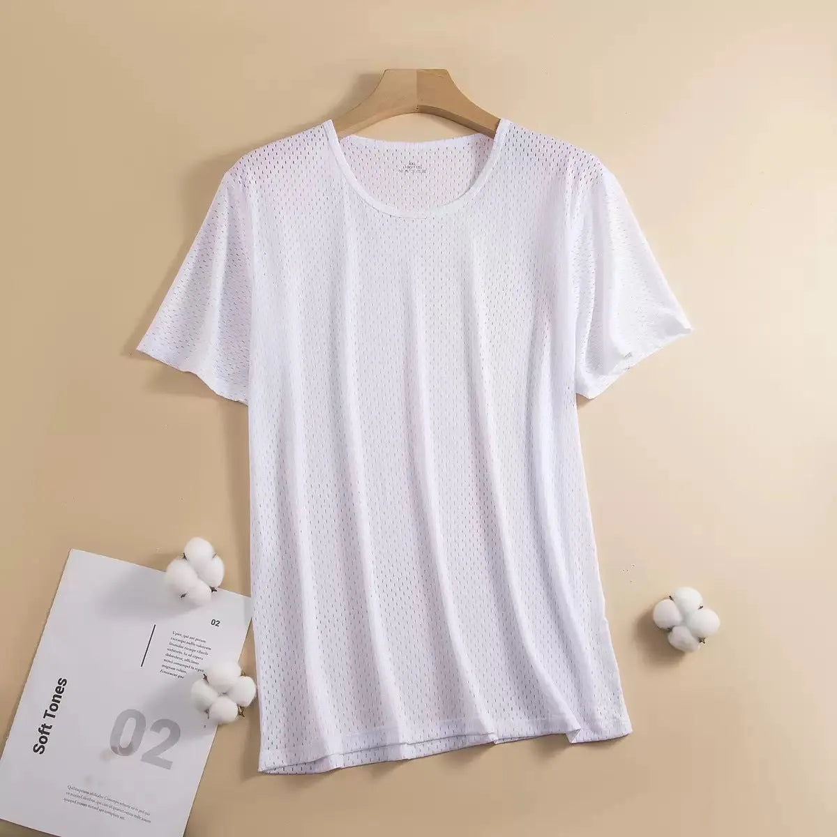 Man wearing a loose-fit ice silk short sleeve T-shirt in a solid colour.