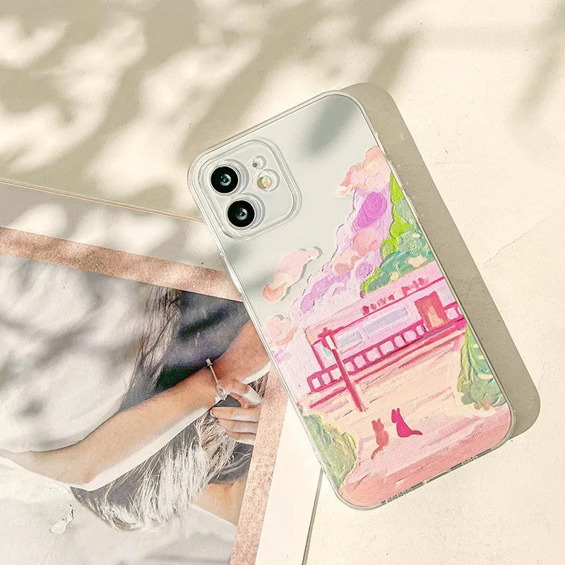 Soft silicone iPhone case featuring a two cat cartoon design on the back.