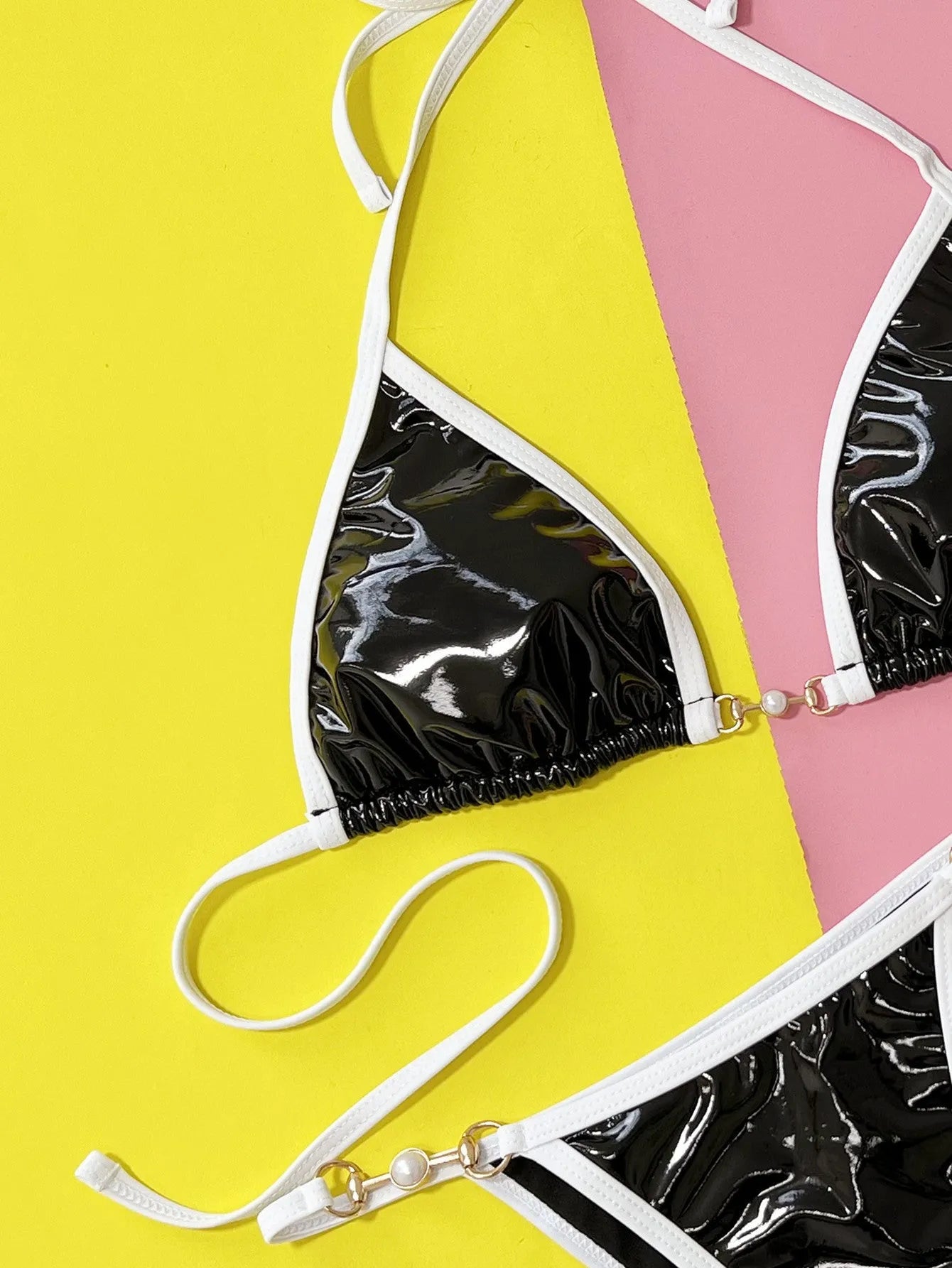 Black women's two-piece split bikini swimsuit with brief styling