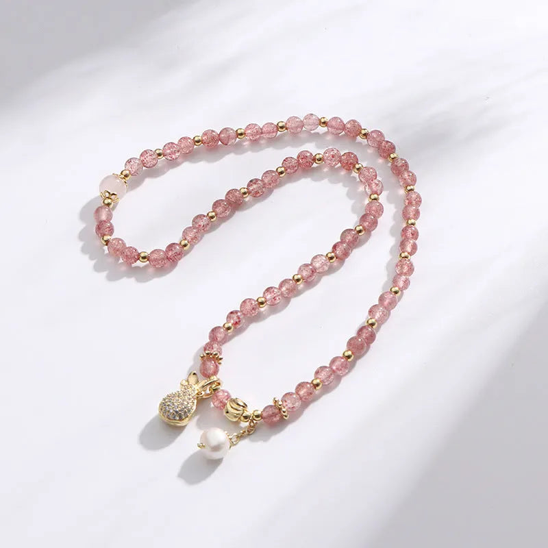 Women's strawberry quartz crystal bracelet with geometric design for money drawing and luck changing