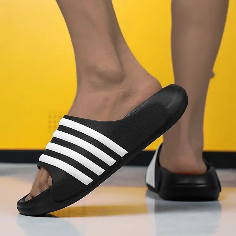Casual unisex slip-on slippers with PVC upper and EVA sole for outdoor leisure wear.