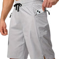 Men's solid colour quick-drying beach shorts in polyester fabric showing straight-leg cut