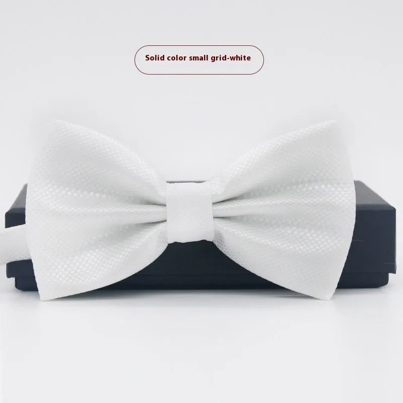 Men's flat head solid colour bow tie in polyester, showing 12cm by 6cm size on a background.