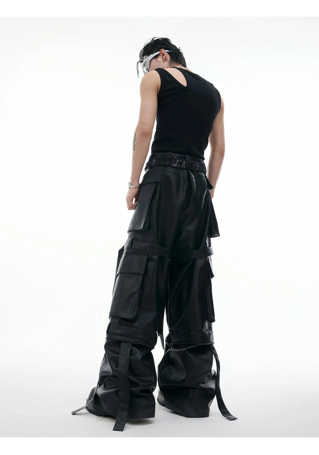 Black quilted leather pants with multiple pockets and loose-fit retro streetwear design