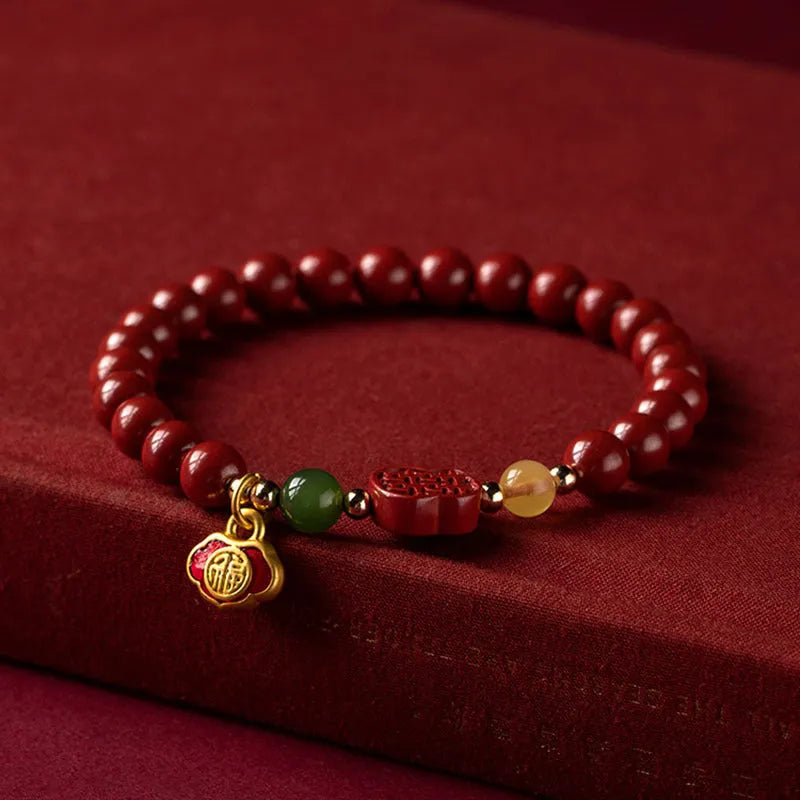 Cinnabar bracelet with fu character in Emperor Sandstone colour, showing 6mm and 8mm bead size options.