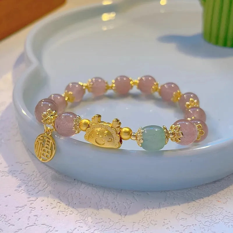 Niche Girlfriends Ice Crack Floral glazed bracelet with red, pink, and white glass beads and a zodiac charm.