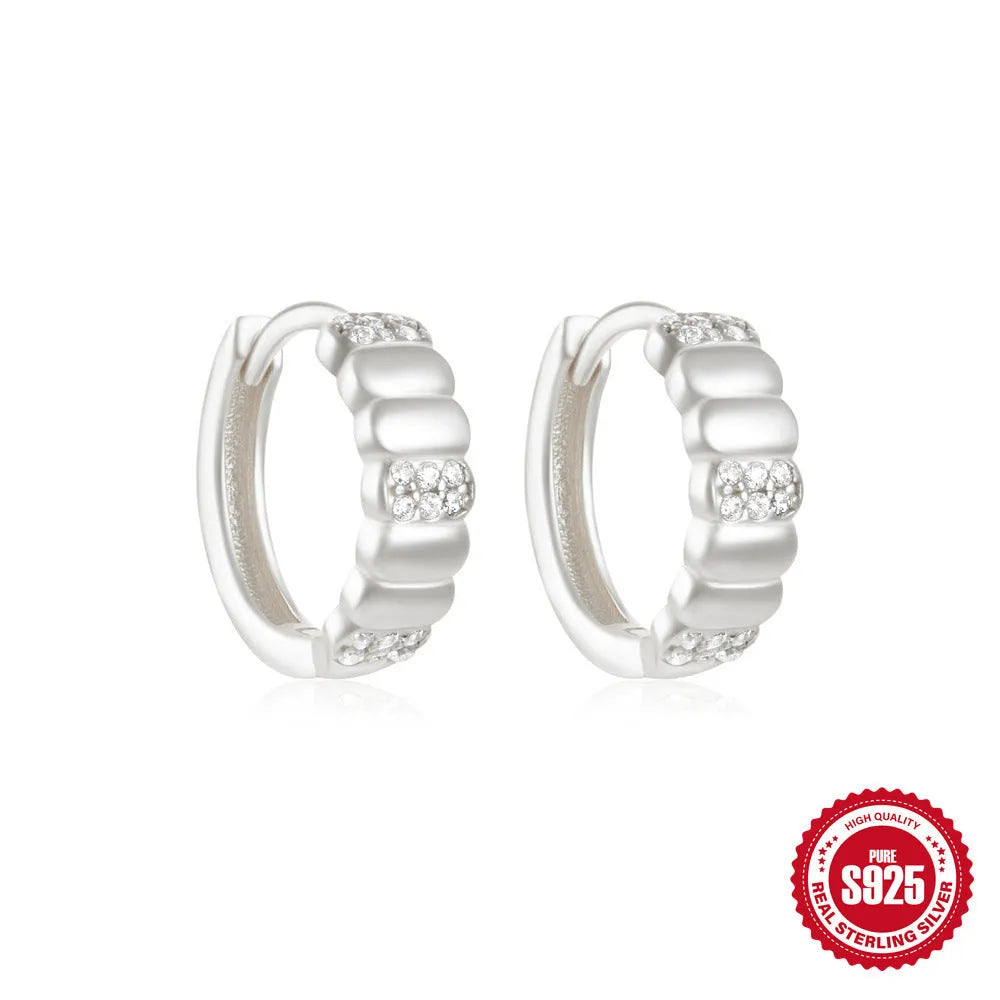 Sterling silver geometric stud earrings with small round designs in gold or silver electroplated finishes