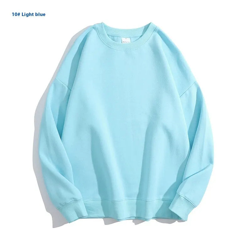A loose round neck off shoulder pullover sweater in a solid colour, with long sleeves.