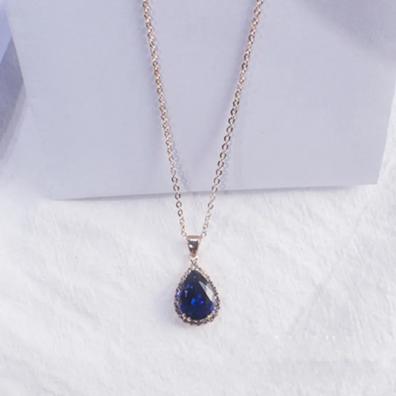 Drop shape geometric pendant necklace with rhinestone inlay in pink rose gold electroplated finish