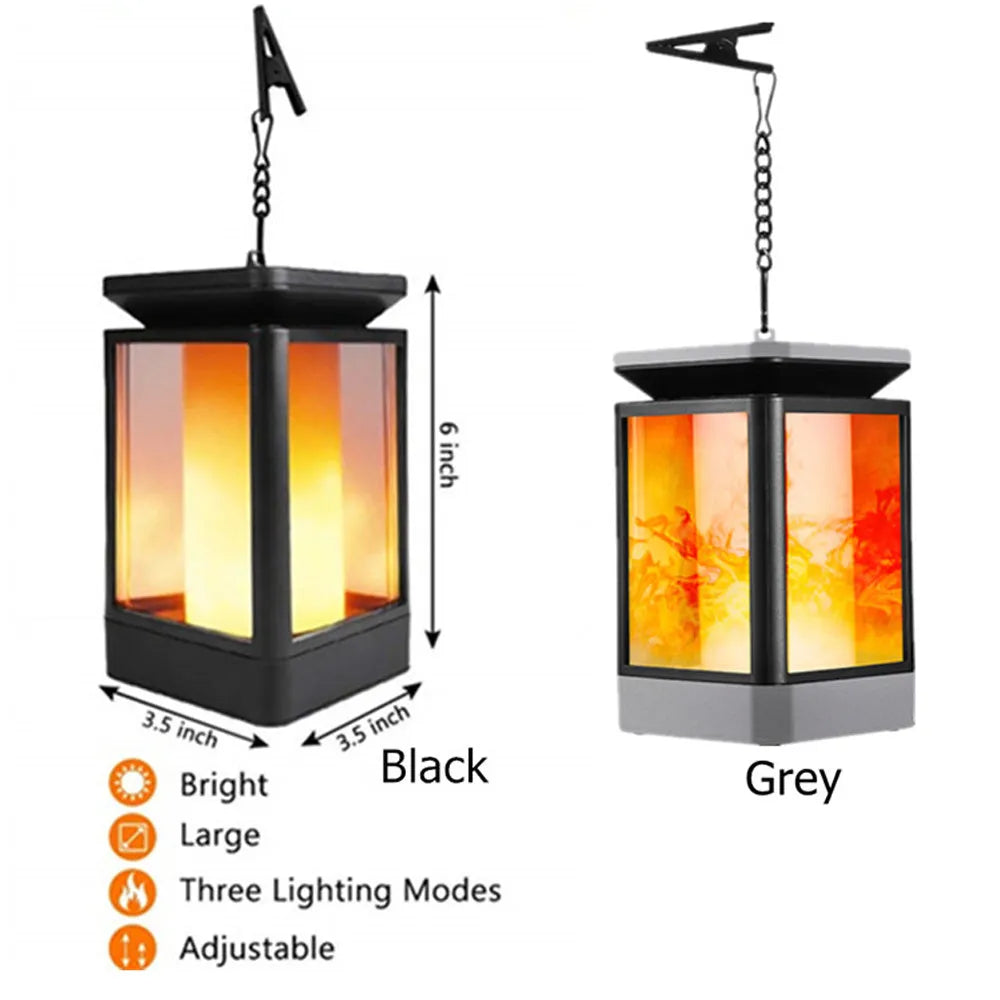 Black antique flame-shaped solar LED garden light with solar panel on top for outdoor pathway illumination