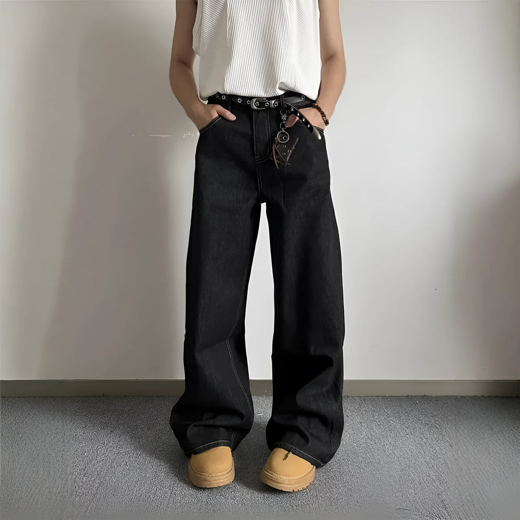 Black loose fit wide-leg denim jeans with a straight leg and mid waist on a hanger.