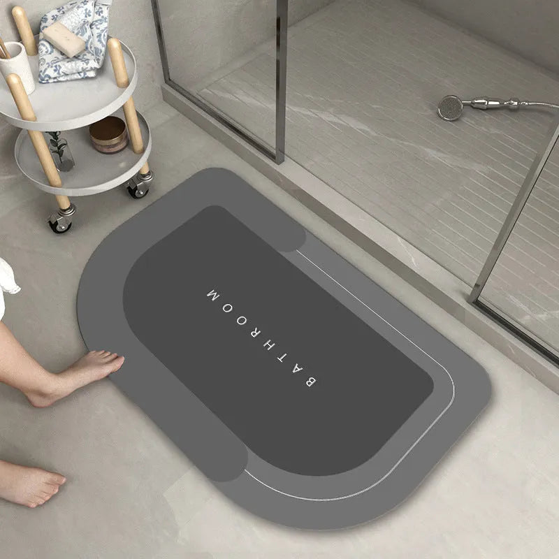 Blended fabric floor mat in an oval shape on a bathroom floor, available in multiple colours and sizes.