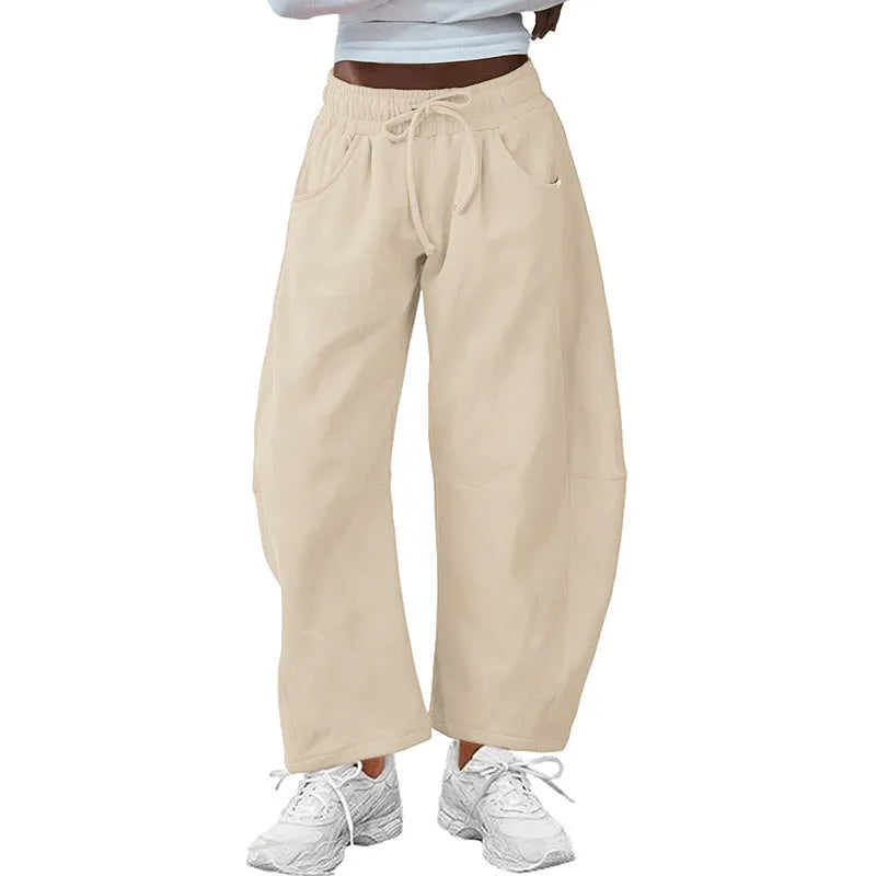 Loose cropped sweatpants with drawstring waist and side pockets in European street style